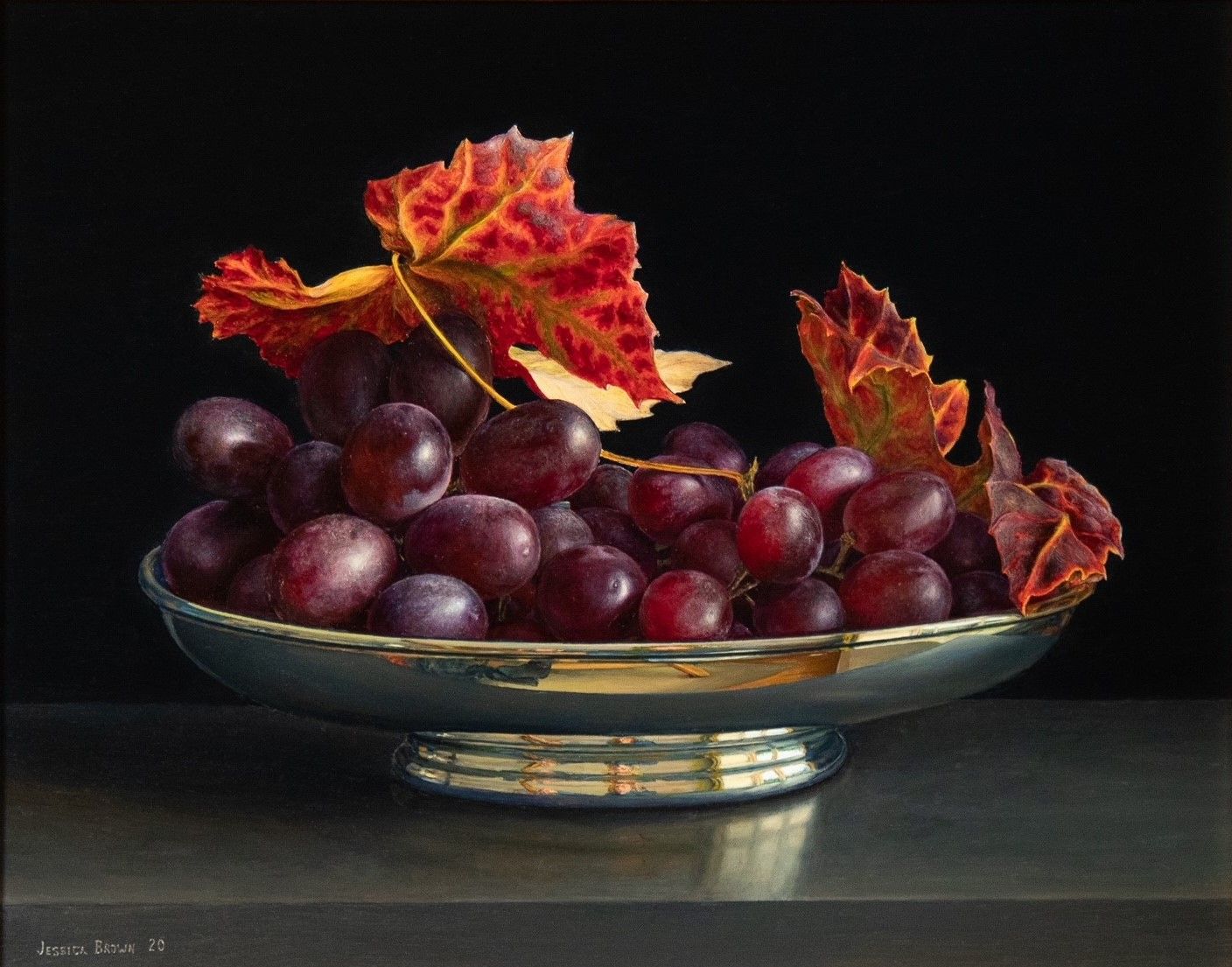 Still Life with Grapes and Vine Leaves in an Oval Silver Bowl by Jessica Brown